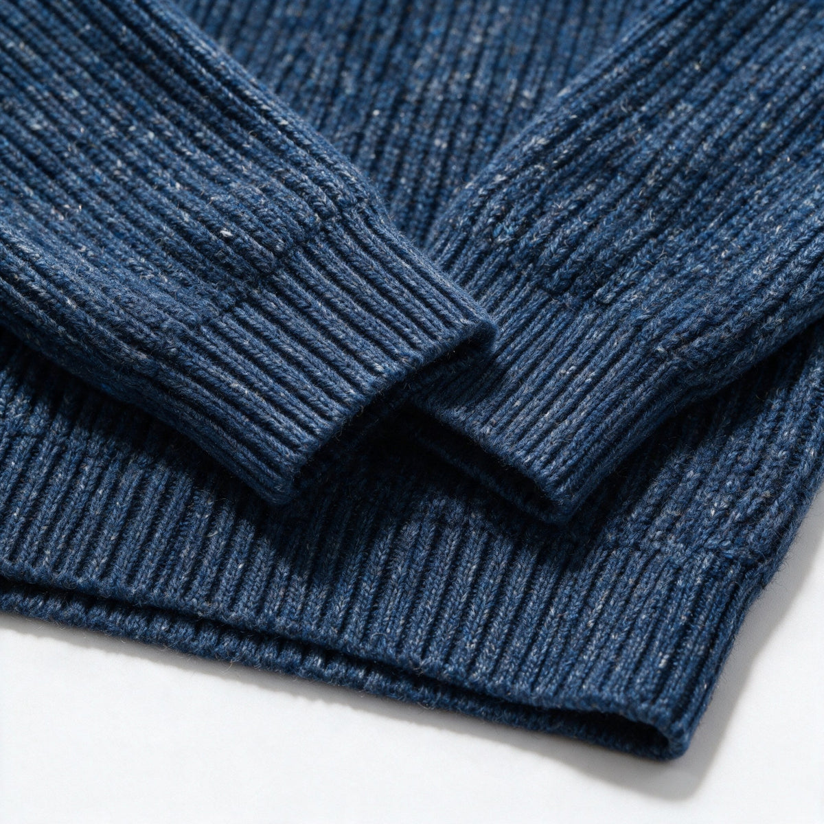 Close-up of the ribbed cuff next to the ribbed hem