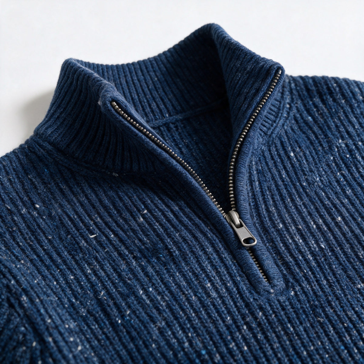 Close-up of the stand collar and short zip of the Fints sweater