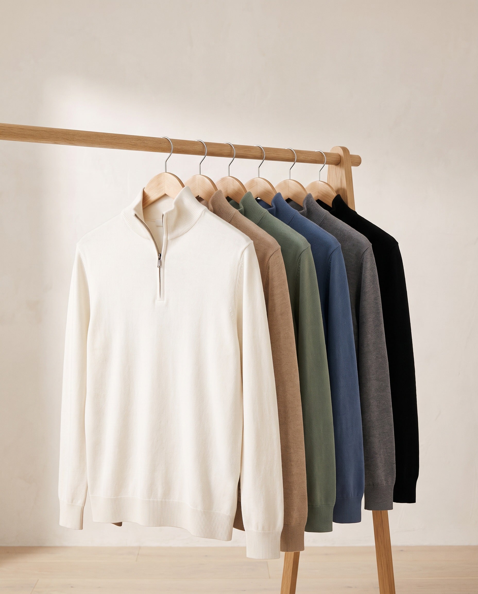 Santous half-zip sweater in all six colours on a rail